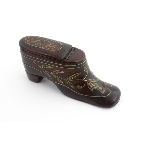 1207 - Treen : A 19thC shoe snuff box modelled as a heeled shoe with hinged top and inlaid thistle decorati... 