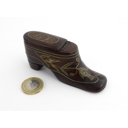 1207 - Treen : A 19thC shoe snuff box modelled as a heeled shoe with hinged top and inlaid thistle decorati... 