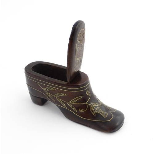 1207 - Treen : A 19thC shoe snuff box modelled as a heeled shoe with hinged top and inlaid thistle decorati... 