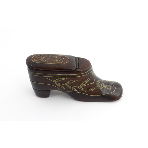 1207 - Treen : A 19thC shoe snuff box modelled as a heeled shoe with hinged top and inlaid thistle decorati... 