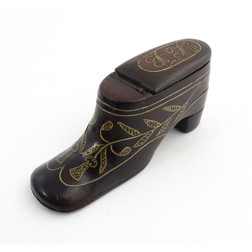 1207 - Treen : A 19thC shoe snuff box modelled as a heeled shoe with hinged top and inlaid thistle decorati... 