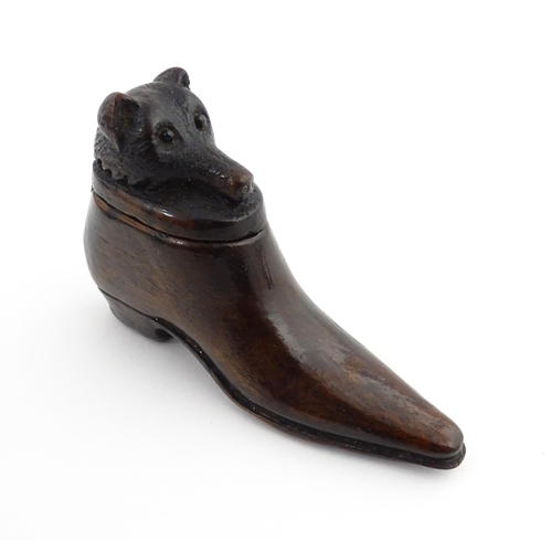 1210 - Treen : A 19thC shoe snuff box, the sliding top with carved bear head detail. Approx. 3 1/4