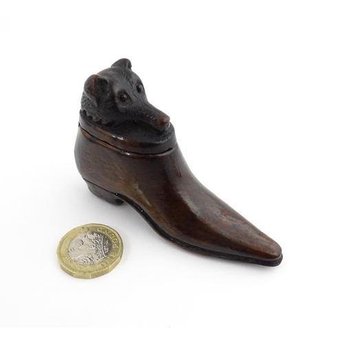 1210 - Treen : A 19thC shoe snuff box, the sliding top with carved bear head detail. Approx. 3 1/4