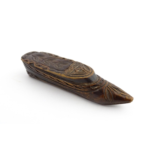 1211 - Treen : A 19thC Continental shoe snuff box with sliding top and carved foliate decoration. Approx. 3... 