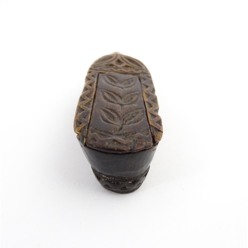 1211 - Treen : A 19thC Continental shoe snuff box with sliding top and carved foliate decoration. Approx. 3... 