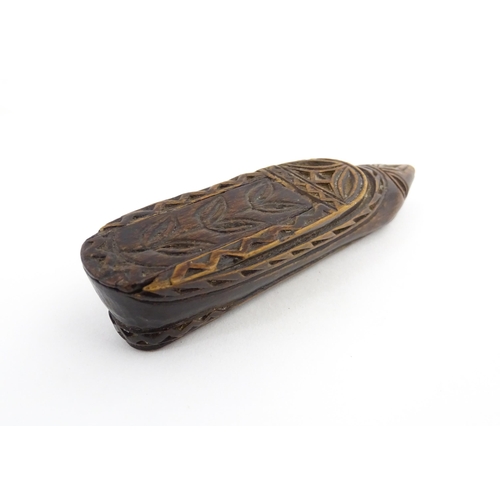 1211 - Treen : A 19thC Continental shoe snuff box with sliding top and carved foliate decoration. Approx. 3... 