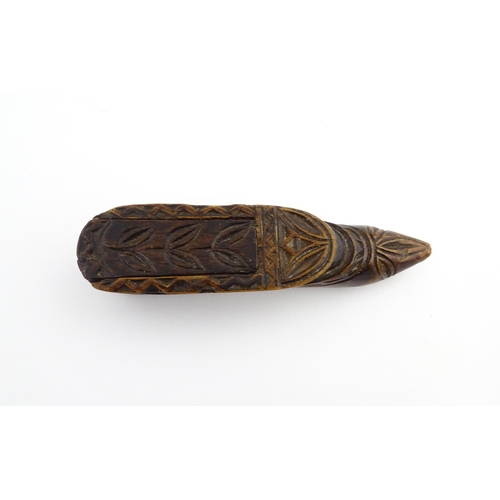 1211 - Treen : A 19thC Continental shoe snuff box with sliding top and carved foliate decoration. Approx. 3... 