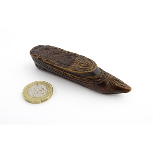 1211 - Treen : A 19thC Continental shoe snuff box with sliding top and carved foliate decoration. Approx. 3... 