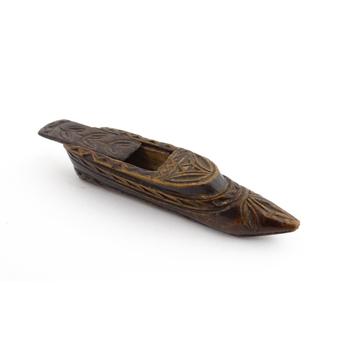 1211 - Treen : A 19thC Continental shoe snuff box with sliding top and carved foliate decoration. Approx. 3... 