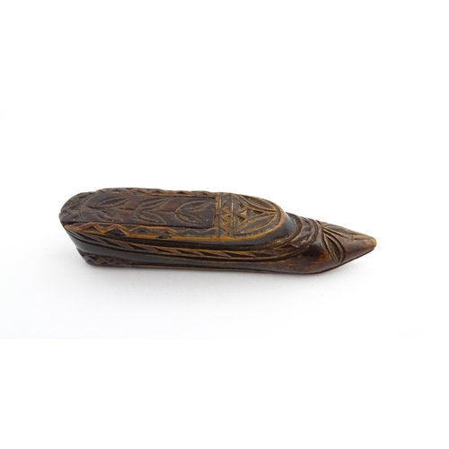 1211 - Treen : A 19thC Continental shoe snuff box with sliding top and carved foliate decoration. Approx. 3... 