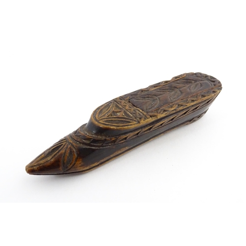 1211 - Treen : A 19thC Continental shoe snuff box with sliding top and carved foliate decoration. Approx. 3... 