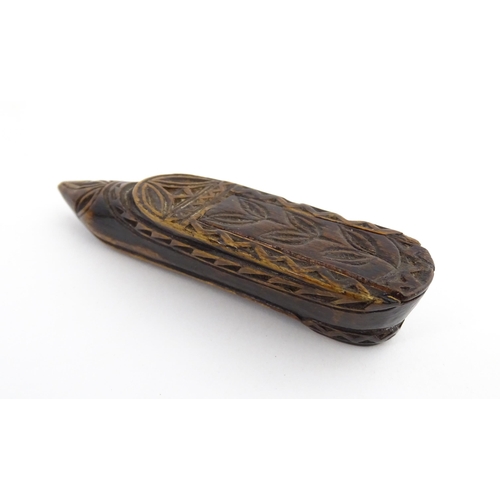 1211 - Treen : A 19thC Continental shoe snuff box with sliding top and carved foliate decoration. Approx. 3... 