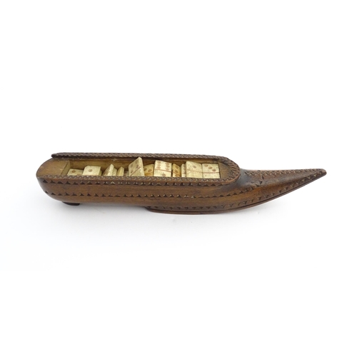 1212 - Treen : A 19thC carved wooden box of large shoe snuff form with chip carved decoration and sliding t... 