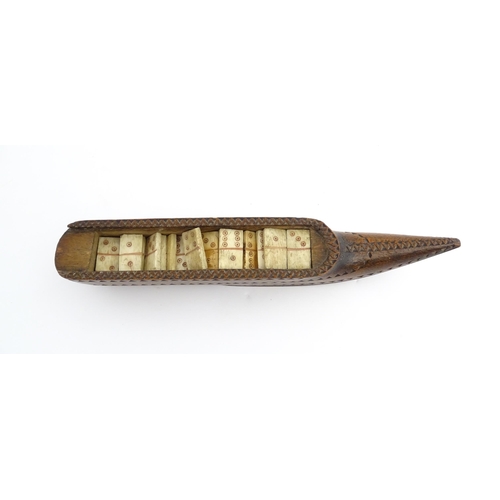 1212 - Treen : A 19thC carved wooden box of large shoe snuff form with chip carved decoration and sliding t... 