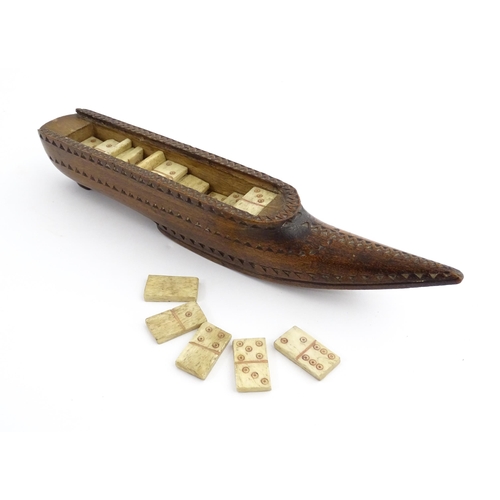 1212 - Treen : A 19thC carved wooden box of large shoe snuff form with chip carved decoration and sliding t... 