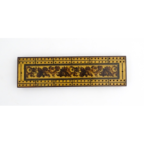 1214 - Treen: Three Tunbridge ware cribbage boards with central floral decoration. Largest approx. 10