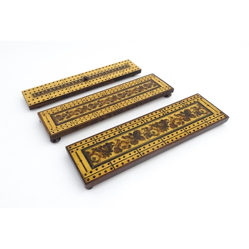 1214 - Treen: Three Tunbridge ware cribbage boards with central floral decoration. Largest approx. 10