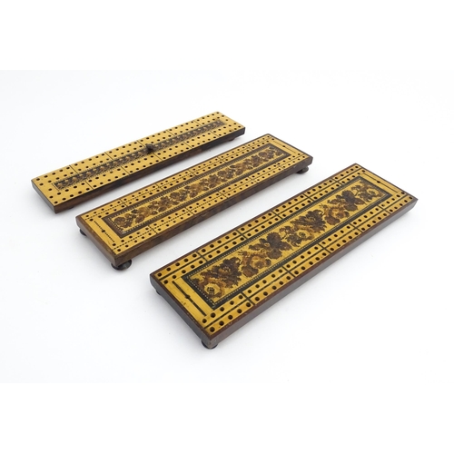 1214 - Treen: Three Tunbridge ware cribbage boards with central floral decoration. Largest approx. 10