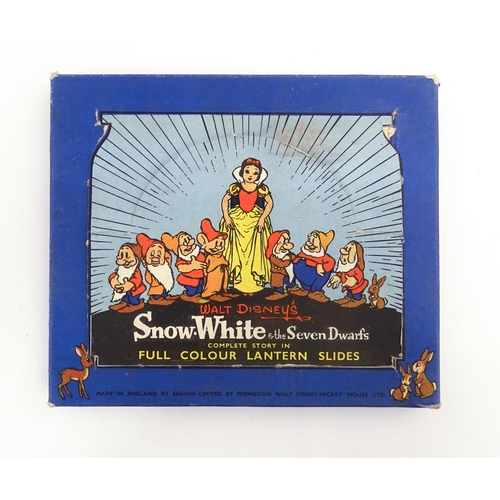 1215A - A quantity of 20thC magic lantern slides, to include Walt Disney's Snow White & the Seven Dwarfs, Mi... 