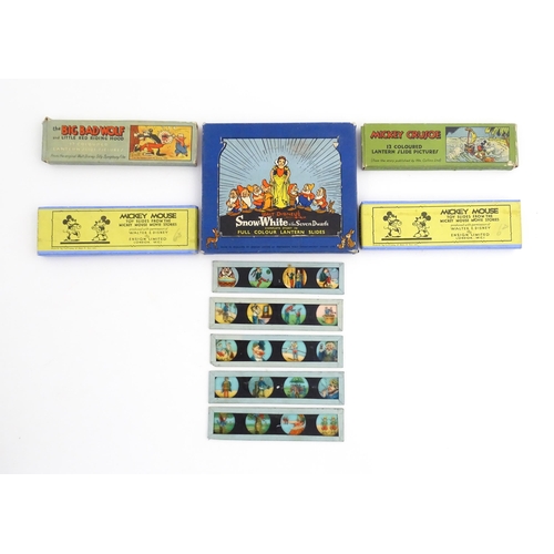 1215A - A quantity of 20thC magic lantern slides, to include Walt Disney's Snow White & the Seven Dwarfs, Mi... 