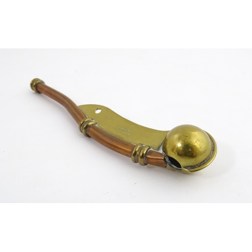 1216 - A 20thC brass and copper Bosun's whistle, engraved Simon Wood. Approx. 4 1/2