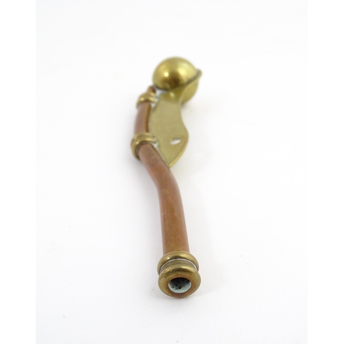 1216 - A 20thC brass and copper Bosun's whistle, engraved Simon Wood. Approx. 4 1/2