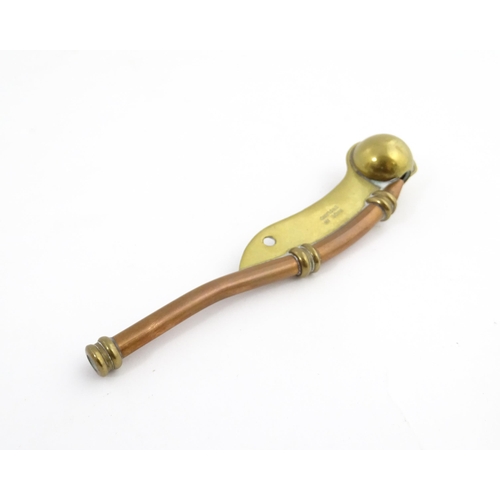 1216 - A 20thC brass and copper Bosun's whistle, engraved Simon Wood. Approx. 4 1/2