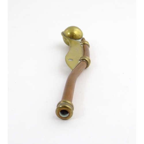 1216 - A 20thC brass and copper Bosun's whistle, engraved Simon Wood. Approx. 4 1/2