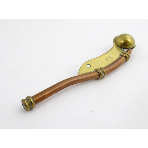 1216 - A 20thC brass and copper Bosun's whistle, engraved Simon Wood. Approx. 4 1/2