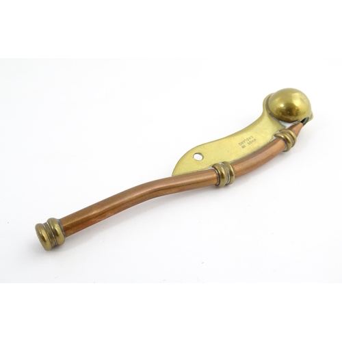 1216 - A 20thC brass and copper Bosun's whistle, engraved Simon Wood. Approx. 4 1/2