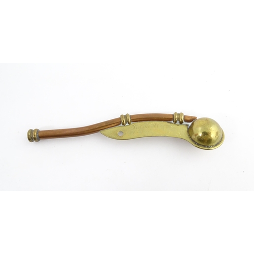 1216 - A 20thC brass and copper Bosun's whistle, engraved Simon Wood. Approx. 4 1/2