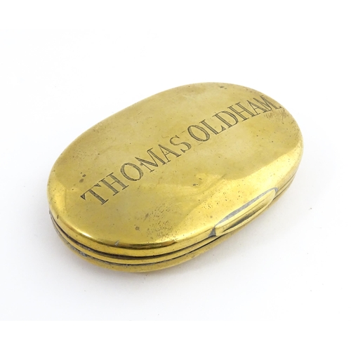 1217 - Two 19thC brass snuff / tobacco boxes of oval form, one engraved Thomas Oldham. Together with an ear... 