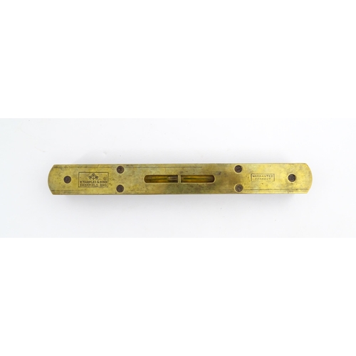 1219 - Militaria : A 20thC W. Marples & Sons spirit level with broad arrow mark. Together with another, a m... 