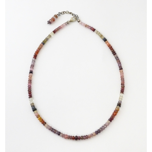 611 - A spinel bead necklace with silver clasp.