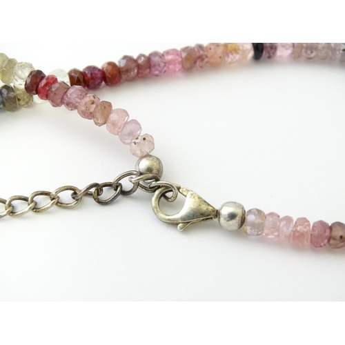 611 - A spinel bead necklace with silver clasp.