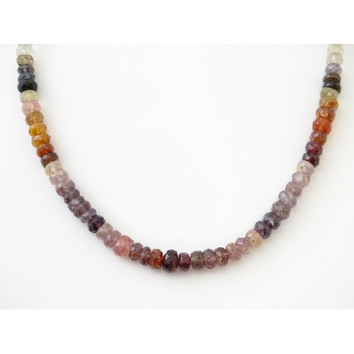 611 - A spinel bead necklace with silver clasp.