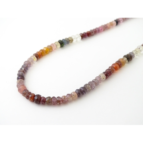 611 - A spinel bead necklace with silver clasp.