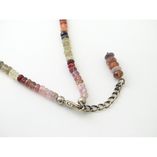 611 - A spinel bead necklace with silver clasp.