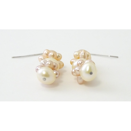 614 - A pair of silver drop earrings set with pearls. Approx. 1 1/2