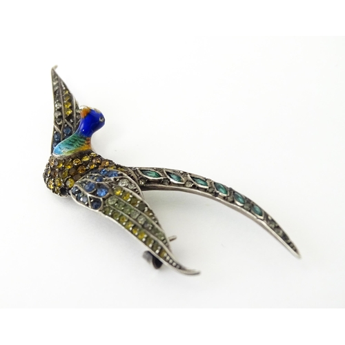 615 - A silver brooch modelled a pheasant in flight with guilloche enamel decoration and coloured stones, ... 