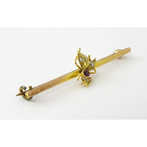 618 - A 9ct gold bar brooch with insect detail set with ruby and pearls. Approx. 1 3/4