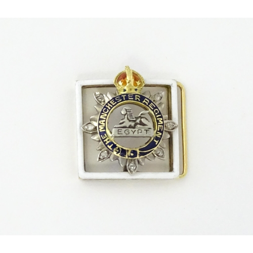 622 - An early to mid 20thC yellow metal novelty jewel formed as a section of regimental buckle / insignia... 