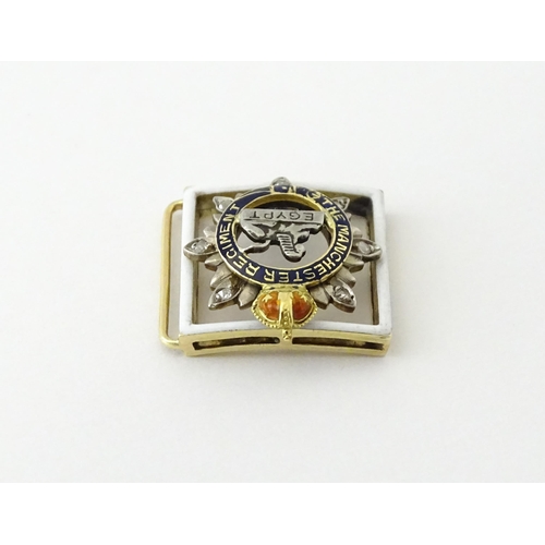 622 - An early to mid 20thC yellow metal novelty jewel formed as a section of regimental buckle / insignia... 