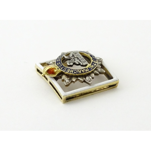 622 - An early to mid 20thC yellow metal novelty jewel formed as a section of regimental buckle / insignia... 