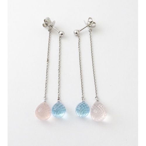 626 - A pair of 18ct white gold drop earrings set with two colour crystal drops. Approx. 2 1/2