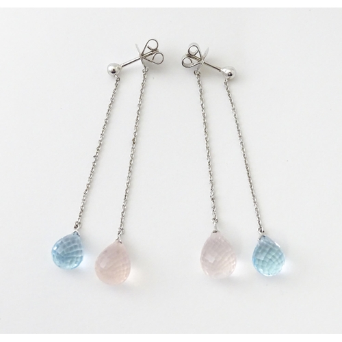 626 - A pair of 18ct white gold drop earrings set with two colour crystal drops. Approx. 2 1/2