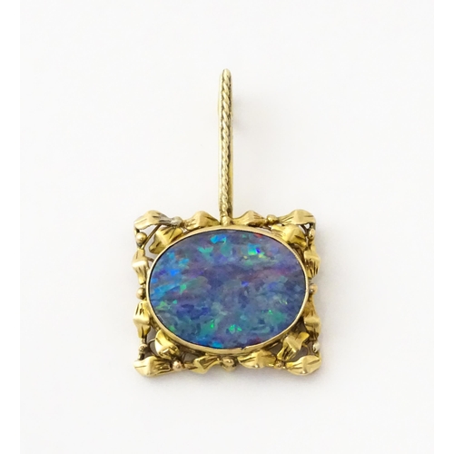 633 - A 9ct gold pendant set with central opal. Approx. 1 1/2