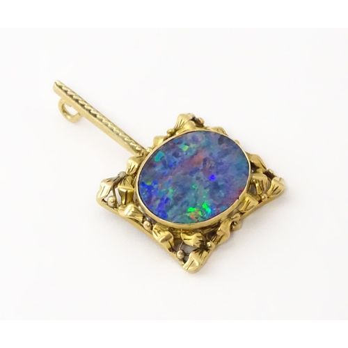 633 - A 9ct gold pendant set with central opal. Approx. 1 1/2