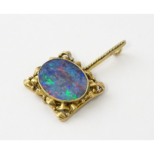 633 - A 9ct gold pendant set with central opal. Approx. 1 1/2