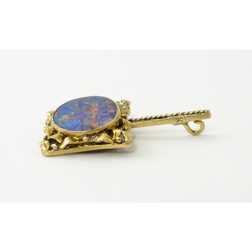 633 - A 9ct gold pendant set with central opal. Approx. 1 1/2